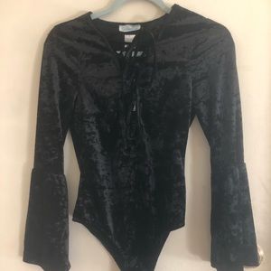 Black lace up body suit with flared sleeves